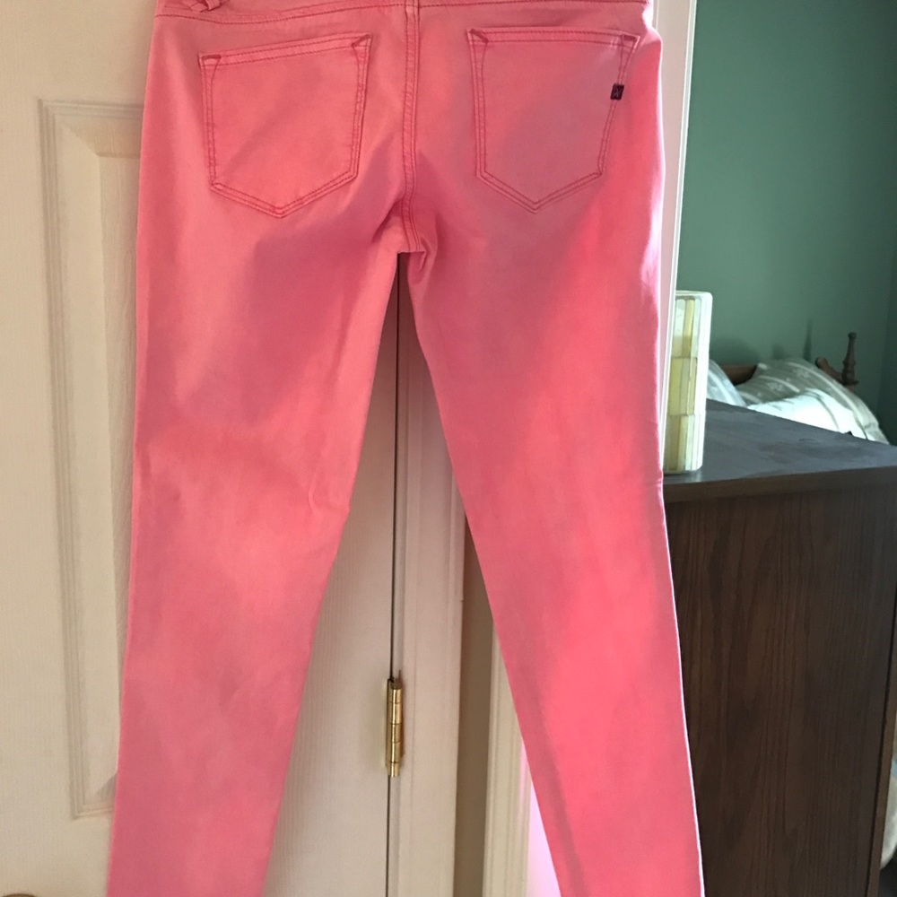 Neon pink skinny pants